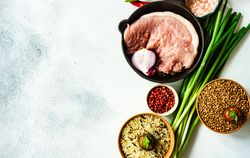 Pork cutlets with grains and green onions to cook for dinner