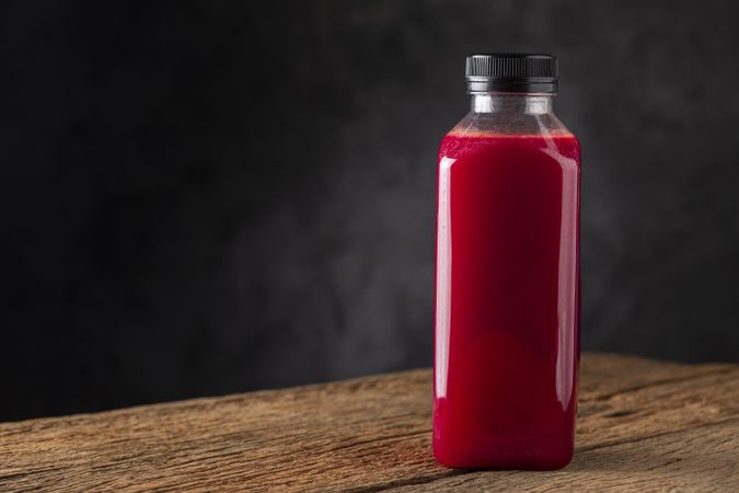 Red beet juice in plastic bottle.
