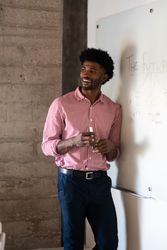 Man presenting ideas at a dry erase board