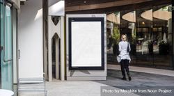 Mockup sign in shopping center with woman walking by 0J7ZN5
