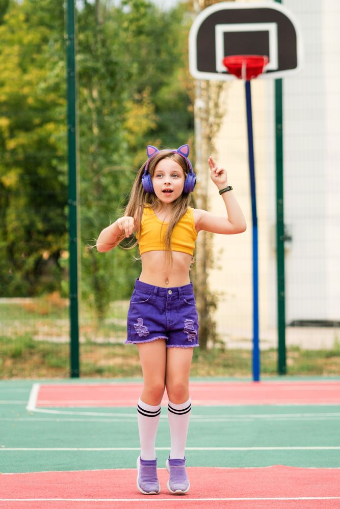 Schoolgirl running on sports ground