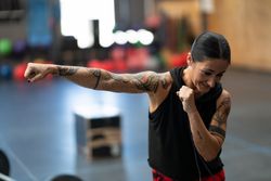 Fit woman practicing punches in gym