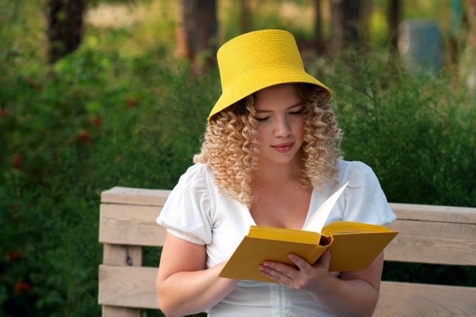 Woman with book outdoors