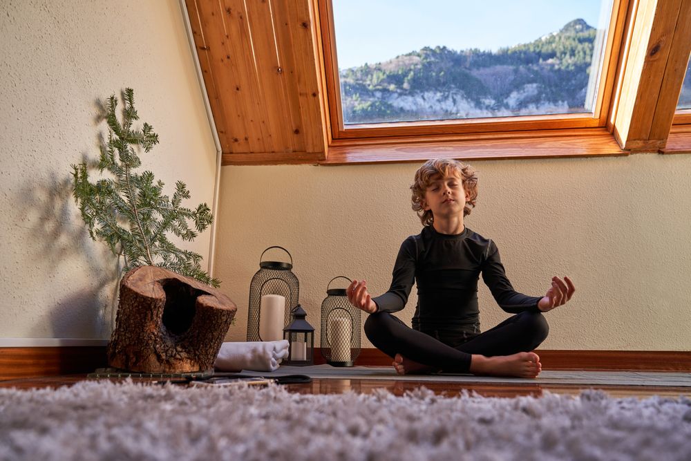 Child meditating in lotus pose