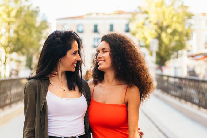 two young women looking each other