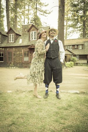 1920s Dressed Couple in Front of Old Cabin