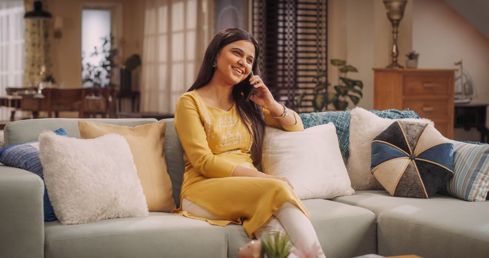 Indian Woman Engaged in a Lively Phone Call at Home