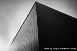 Grayscale photo of building in close-up under sky 47q6l0