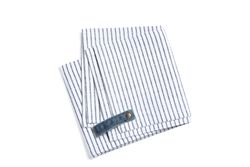 Folded fabric napkin isolated on plain background