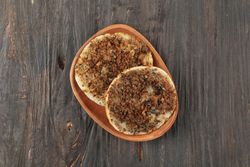 Surabi oncom, Indonesian pancake with fermented soybean on wooden table
