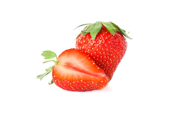 Strawberries isolated on light background. Summer sweet fruits and berries