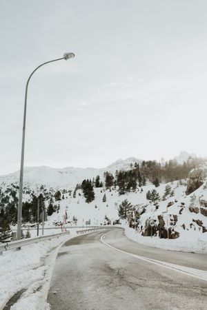 Wonderful view of hills in snow on a road