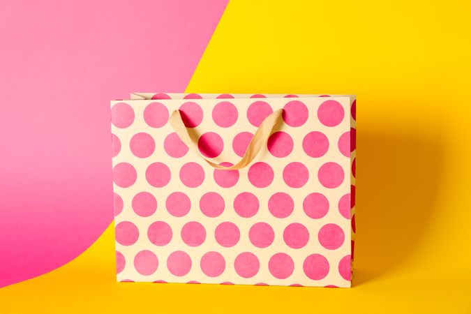 Paper bag on multicolor background, space for text