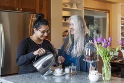 Woman pouring hot water for tea
