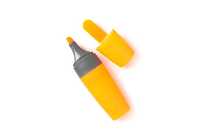 Color office highlighter isolated on plain background