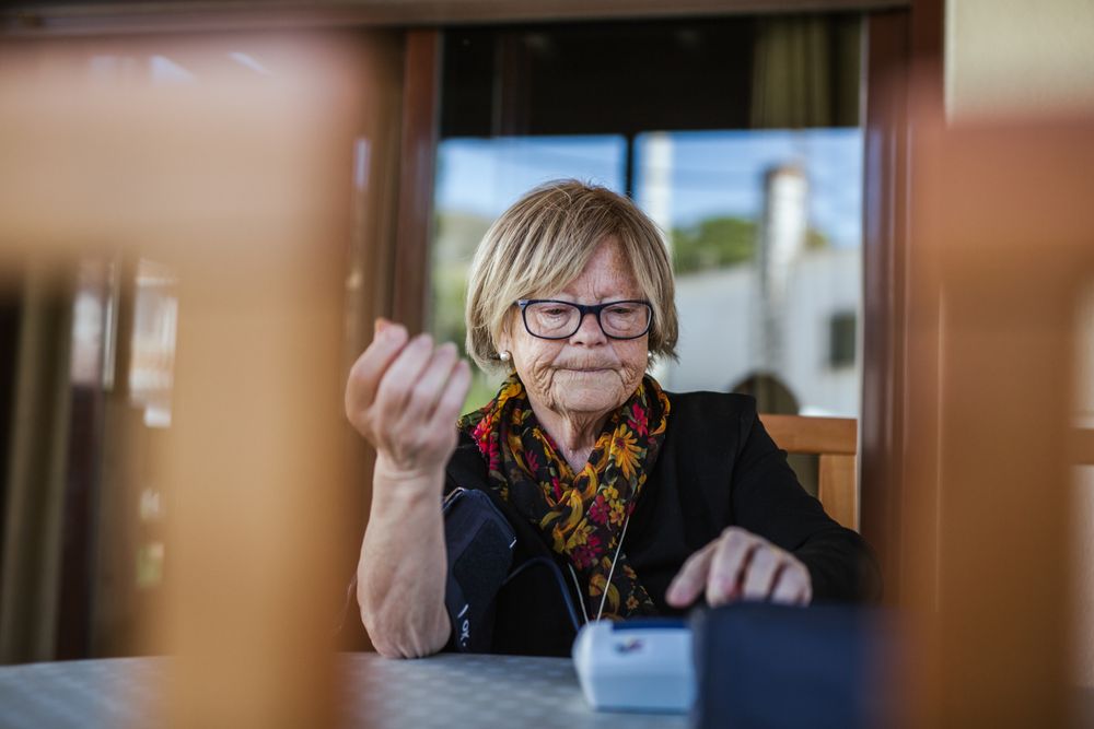 Older female measuring blood pressure