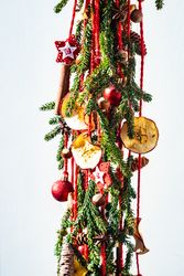 Christmas festive composition with pine, baubles and dried apple slices
