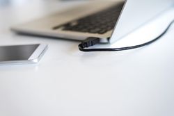 Laptop and phone on bright desk