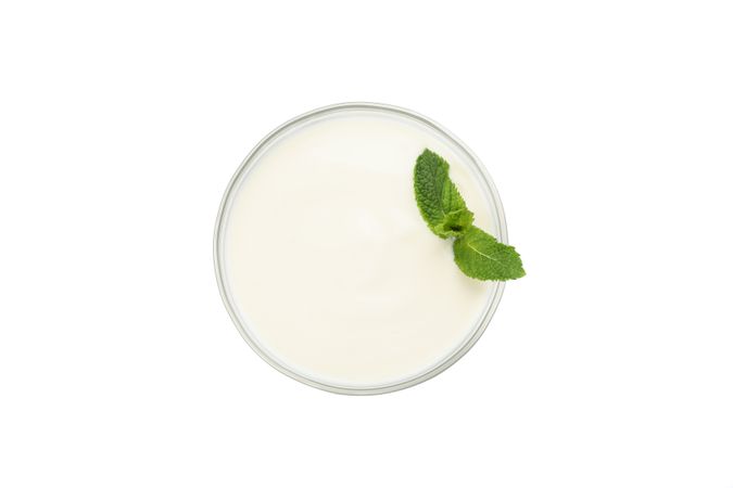 Bowl of sour cream yogurt isolated on light background