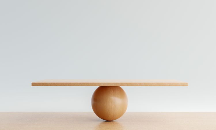 Wooden board balancing on sphere