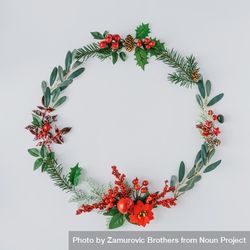 Flat lay of holiday wreath on light background 4OOrj4