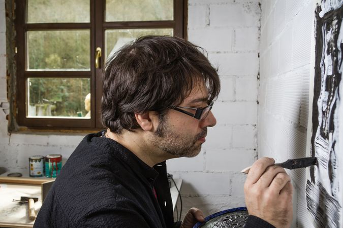 Painter artist working on a oil canvas