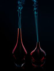Glass bottles emitting smoke