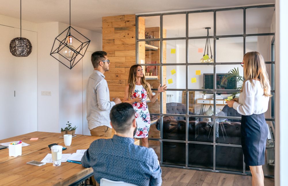 Business people talking in a work meeting sticking notes