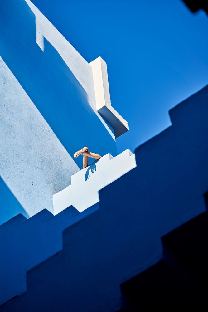 Crop arms hanging from the top of the building