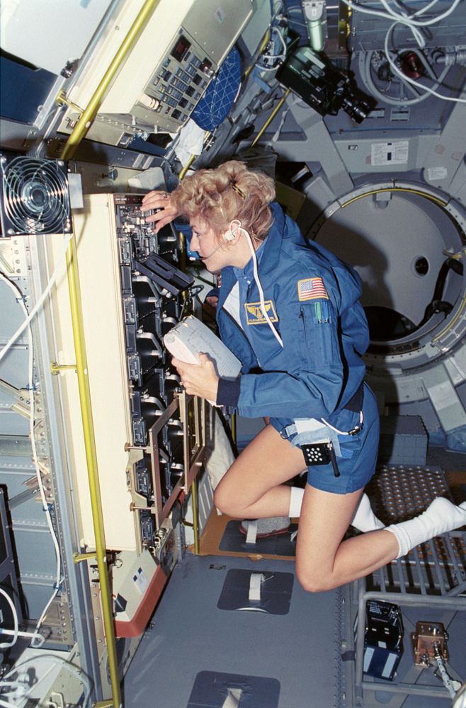 Payload specialist Millie Hughes-Fulford checks the Research Animal Holding Facility