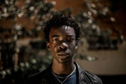 Portrait of young man in dark leather jacket