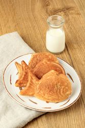 Plate of Japanese taiyaki with carafe of milk