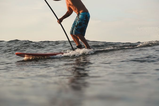Man on surf board on water surface