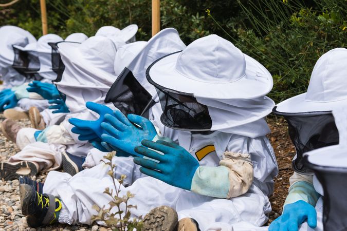 Unrecognizable children in costumes in apiary
