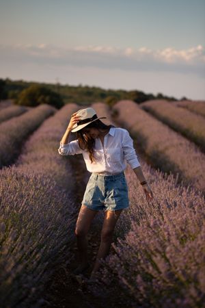 Woman walking in lavender field