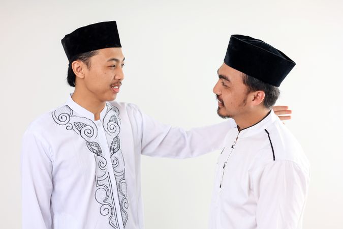 Two Asian Muslim Male People Hug Each and Forgive Each Other Celebrate Eid Al Fitr
