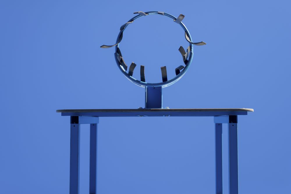 Low angle view of basketball hoop against blue sky