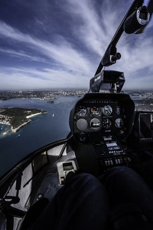 Helicopter flying over land and water