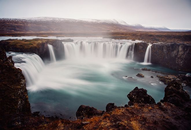 Waterfall between lands of valley