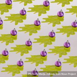 Pattern of purple Christmas decoration with green abstract tree 56q8l0