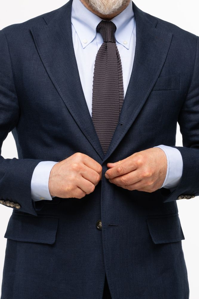Businessman Buttoning Suit Jacket
