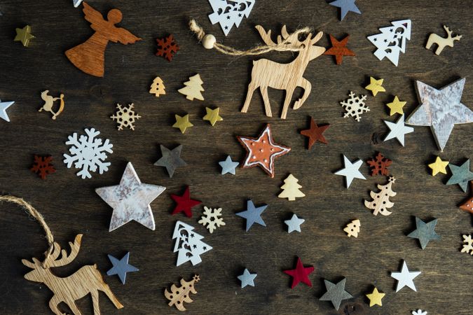 Top view of flat cut out Christmas ornaments scattered on table