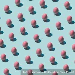 Pattern made of pink eggs on pastel blue background 0LaZy5