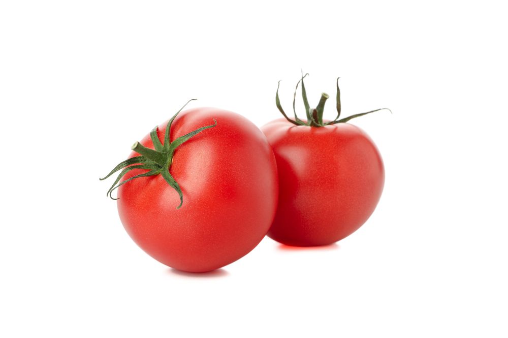 Fresh ripe tomatoes isolated on plain background