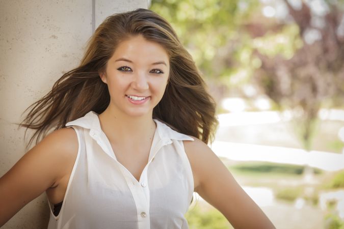 Portrait Of Asian Woman Smiling Outdoors On Nice Day