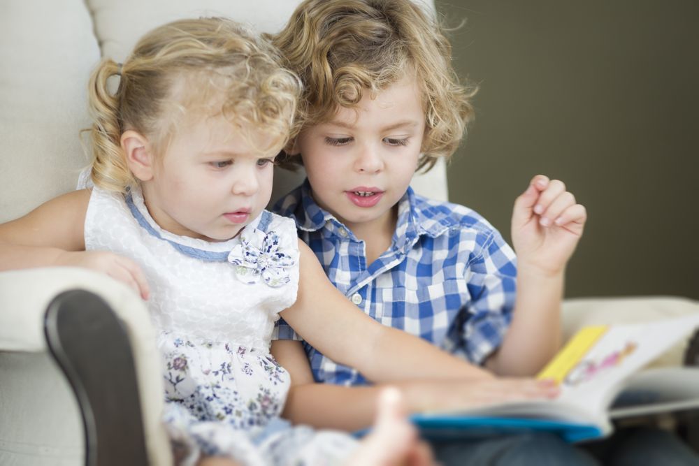 Brother and Sister Reading a Book Together