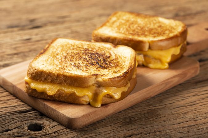 Grilled ham and cheese. Sandwich with cheese and ham on grill.