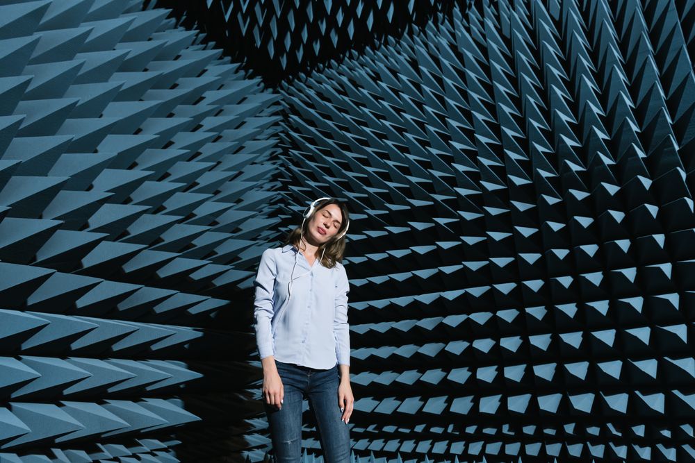 Woman in sound room listening to music