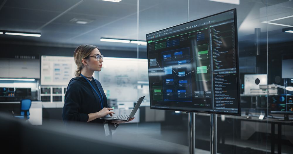 Portrait of a Multiethnic QA Engineer Working on Finding and Fixing Bugs in a Product or Program Software Code Before the Launch.