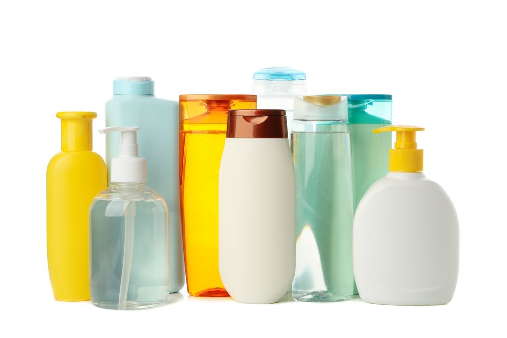 Blank bottles for cosmetics isolated on light background